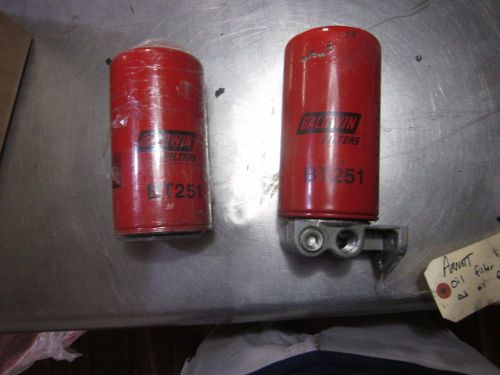A set of two baldwin bt251 oil filters with mount