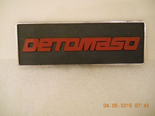 Vintage detomaso  name plate red lettering black background