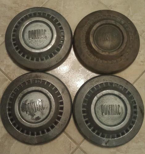 4 original 1965/66 pontiac hubcaps