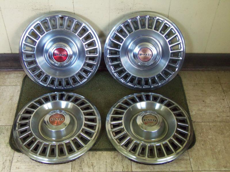 67 68 pontiac 14" hub caps set of 4 pmd wheel covers red center