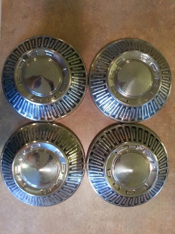 1966 ford galaxie hub caps.  set of 4.  nice hubcaps, 