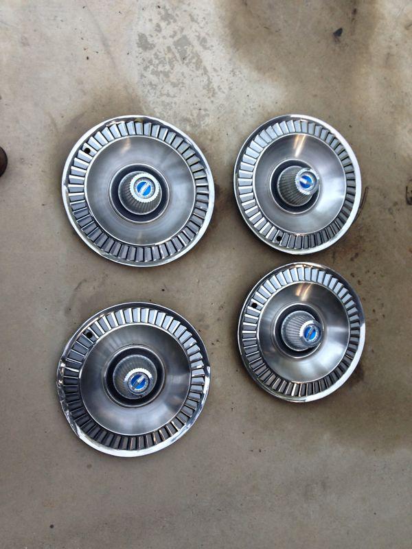 1964 ford galaxie hubcaps  with blue inserts