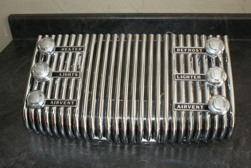 1953 buick dash radio grill with knobs.. good condition