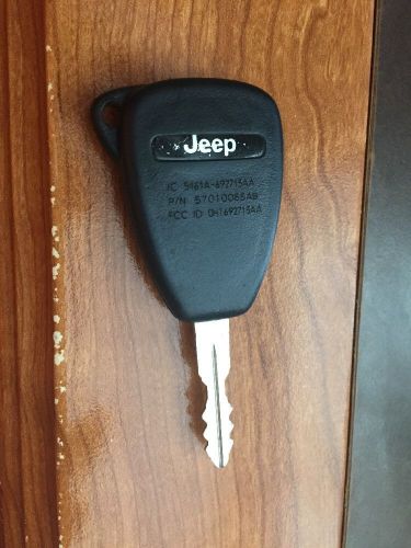 Jeep 57010065aa factory oem key fob keyless entry remote alarm replace