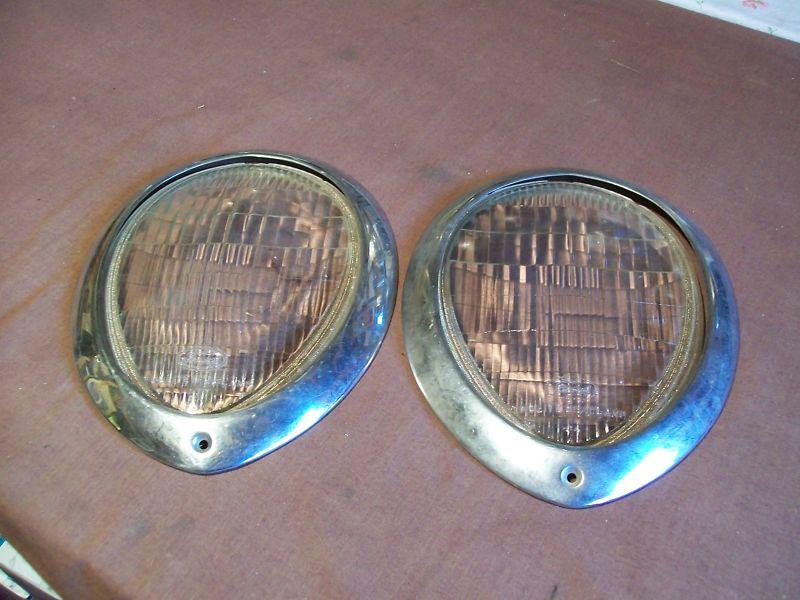 Pair 1938 ford headlight lenses and trim rings