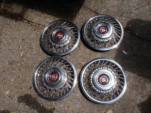 1989 1990 1991 1992 1993 15&#034; cadillac hubcap 4 of em 3 are nice fwd useable