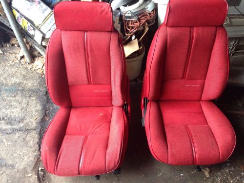 Vintage red camaro front and rear seats
