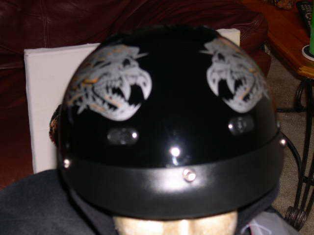 Motorcycle half helmet rodia black background with a alien design