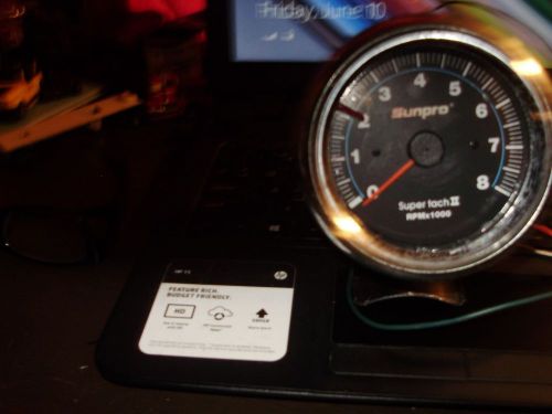 Excellant condition sunpro tachometer with mounting bracket and wiring