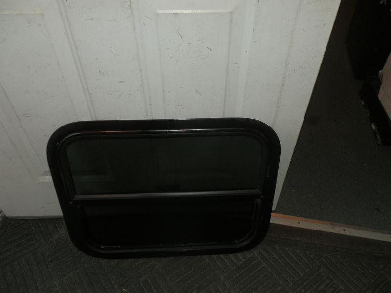 Rv black tinted up and down window r.o. 18" tall x 22" wide 