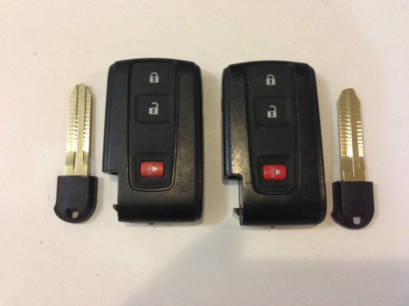 Toyota prius lot of 2 smart key less with uncut insert blade 04-09 silver logo