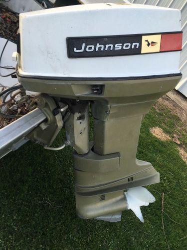 Johnson 50 hp outboard motor with controls.