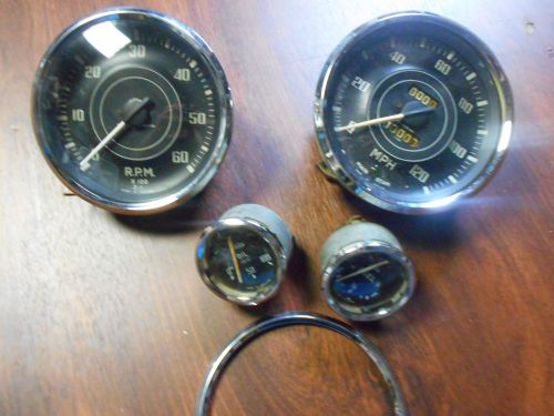 Lot of triumph yeager gauges, 4 conves glass lens year unkown