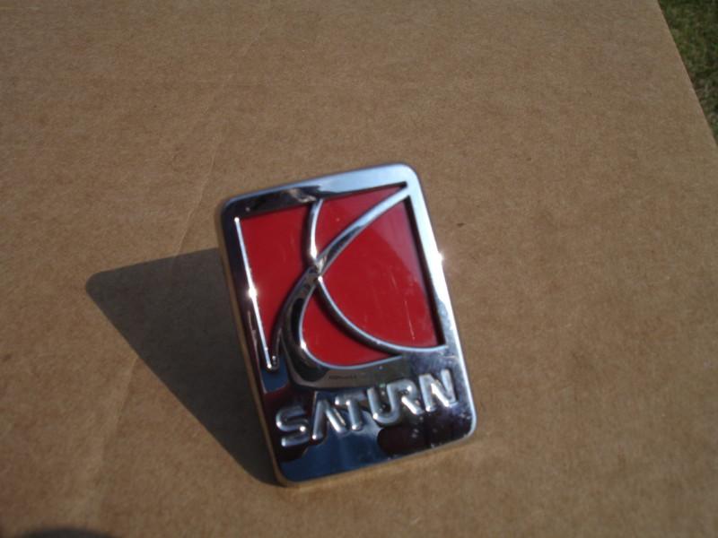 Saturn fender emblem oem part # 3793       2 x 1 1/2 inches