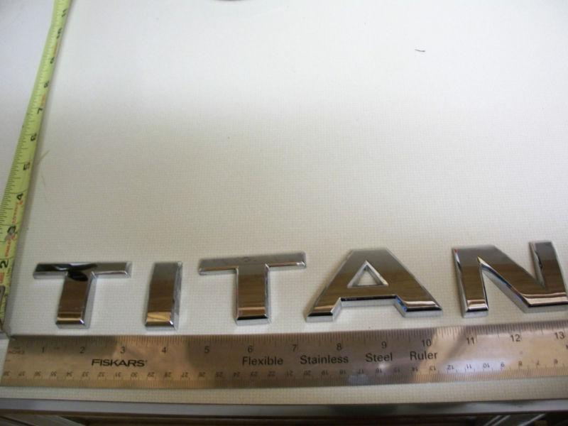 Nissan titan letters emblem chrome bagde oem used  w free shipping