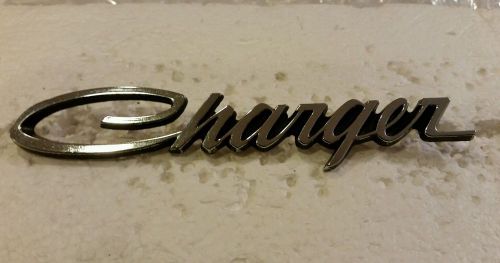 1969 dodge charger grill or headlamp door &#039;charger&#039; script emblem