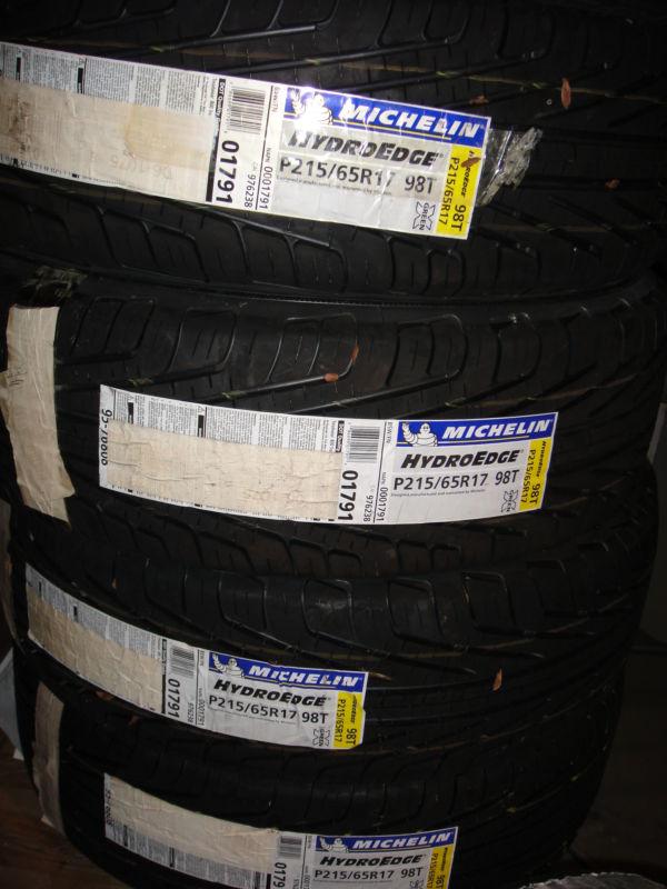 Set of four (4) new michelin hydroedge tires p215/65x17" 215 65 17 100% tread