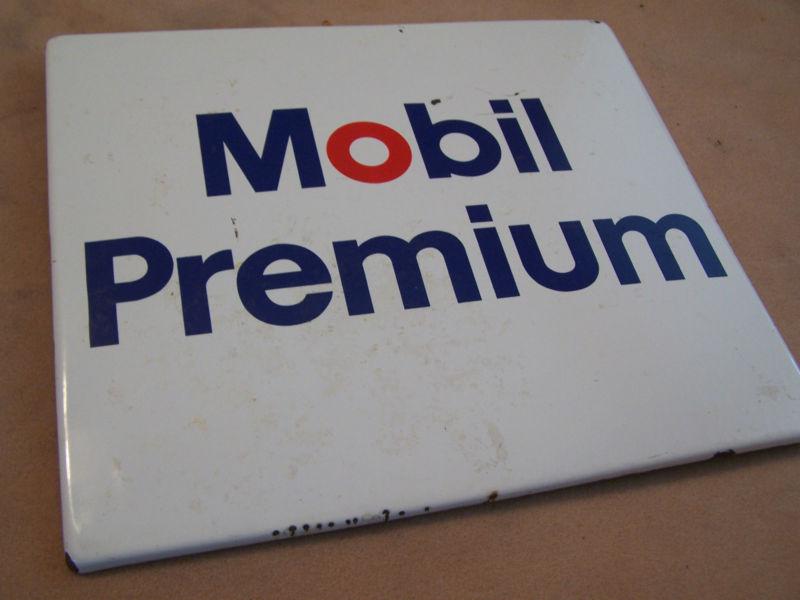 Vintage mobil gasoline premium panel from gas pump porcelain over steel