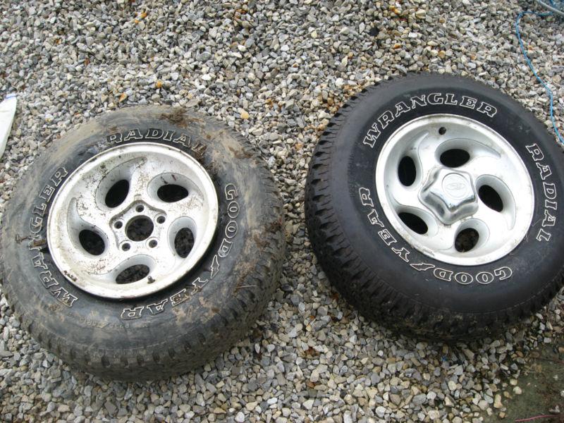 Ford rims & goodyear tires,(.look)          one new tire