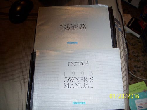 A owners manual&amp;warranty information book for a 1995 mazda protege w/vinyl case