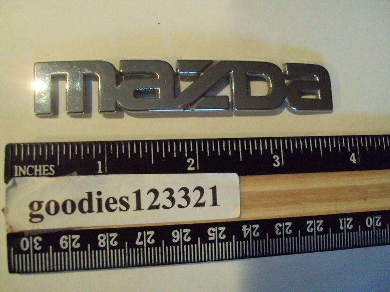 Mazda chrome emblem used 3 1/2" x 1/2"