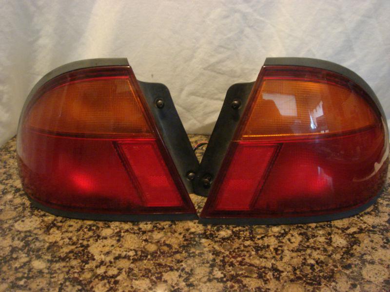 Mazda protege tail lights 1995-1998 both sides wiring and bulbs included
