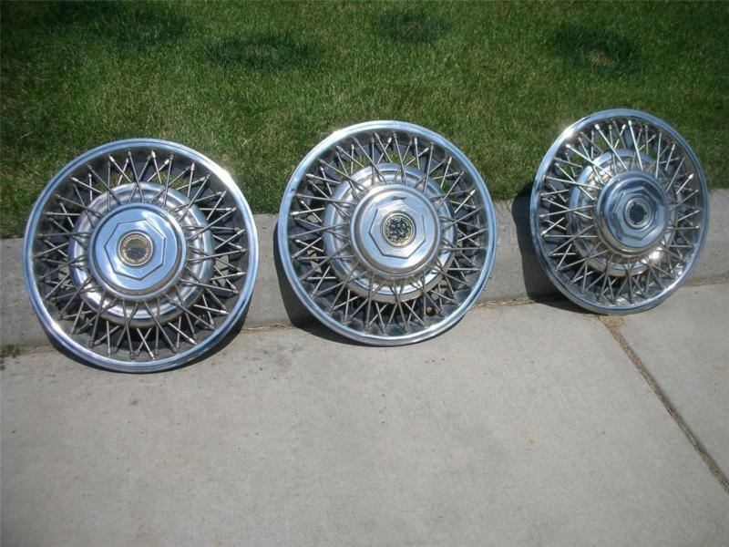 3 (three) general motors corporation (gm) 15" wire spoke hubcaps
