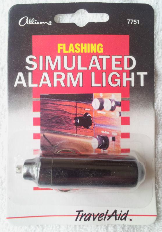 Flashing simulated fake red auto alarm light for car or truck security