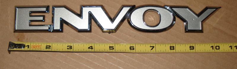 Silver & chrome plastic gmc envoy emblem - 10" long