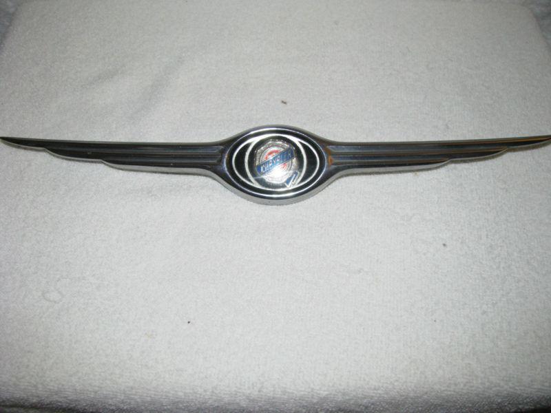 2001-04 chrysler sebring sedan front bumper wing emblem oem 4805259