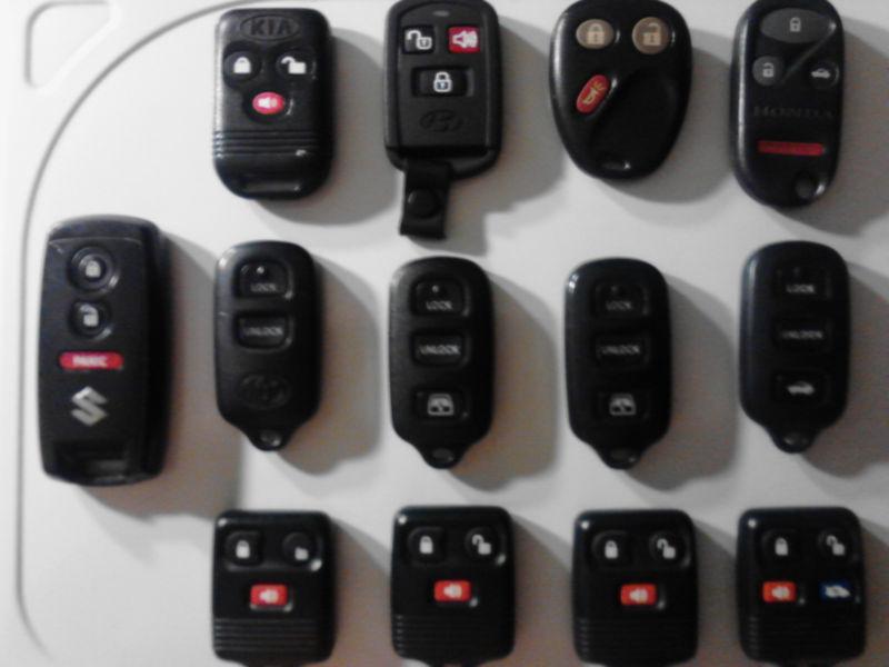 Lot of thirteen automotive key fobs