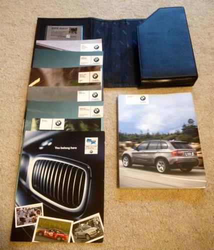 2008 bmw e70 x5 owner's manual, info pamphlets, and leather case