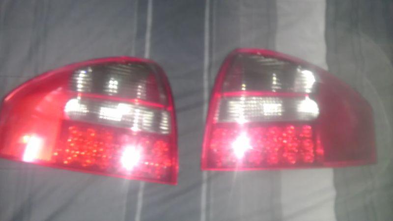  depo 98-04 audi a6 c5 4d sedan red / smoke led tail light  used  taillights
