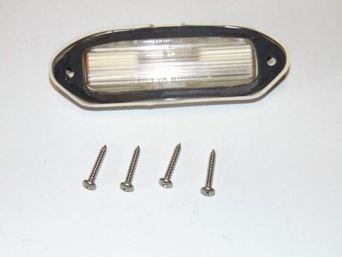 Used license plate light with new screws camaro 74 75 76 77