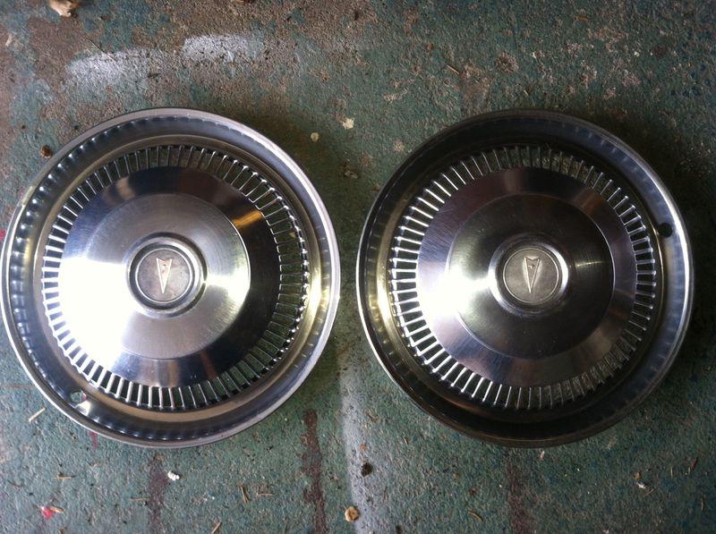 Pair of 14" pontiac hubcaps