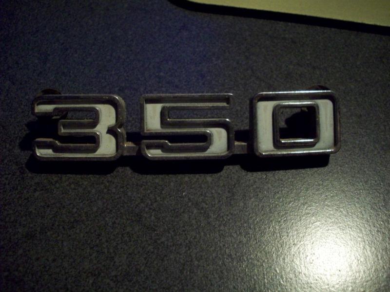 350 chevy fender emblem part # 3962949, original