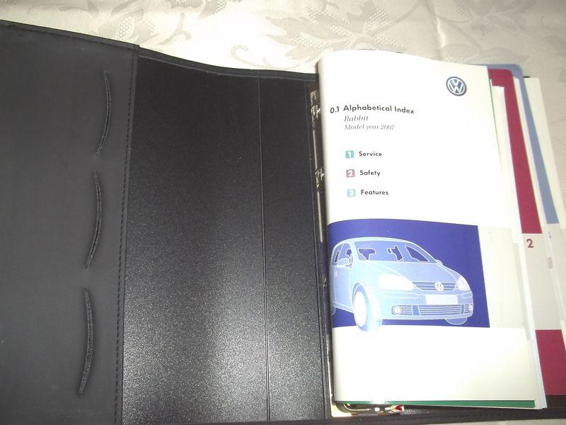 2007 vw rabbit owner's manual set & black vw 4 ringed binder factory case. oem