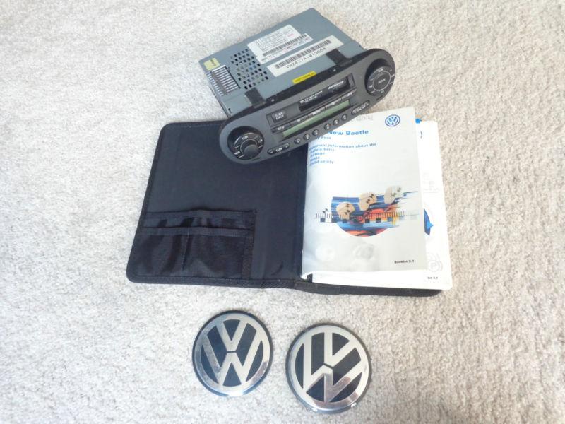 2001 vintage voltswagen beetle radio player, manual, and symbol monogram caps