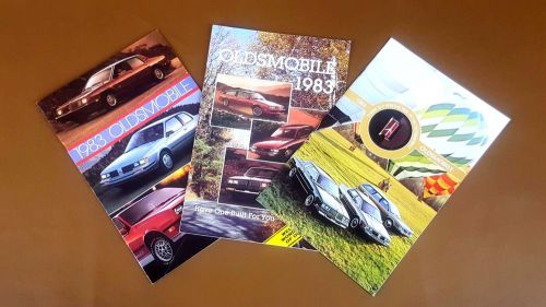 Lot of 3 oldsmobile sales brochures/mailers (2 1983, 1 1984)