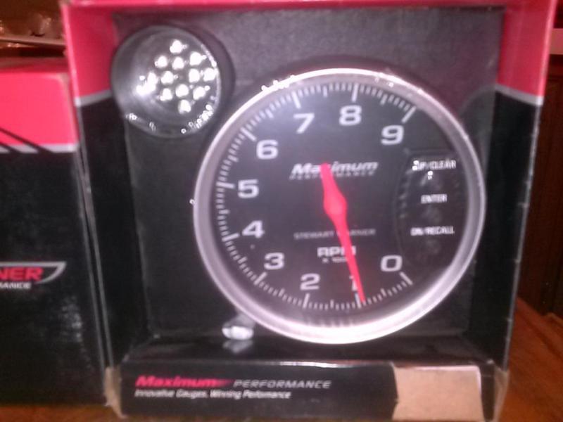 Stewart warner 5" racing tach with shift light 0-9000 rpm black face