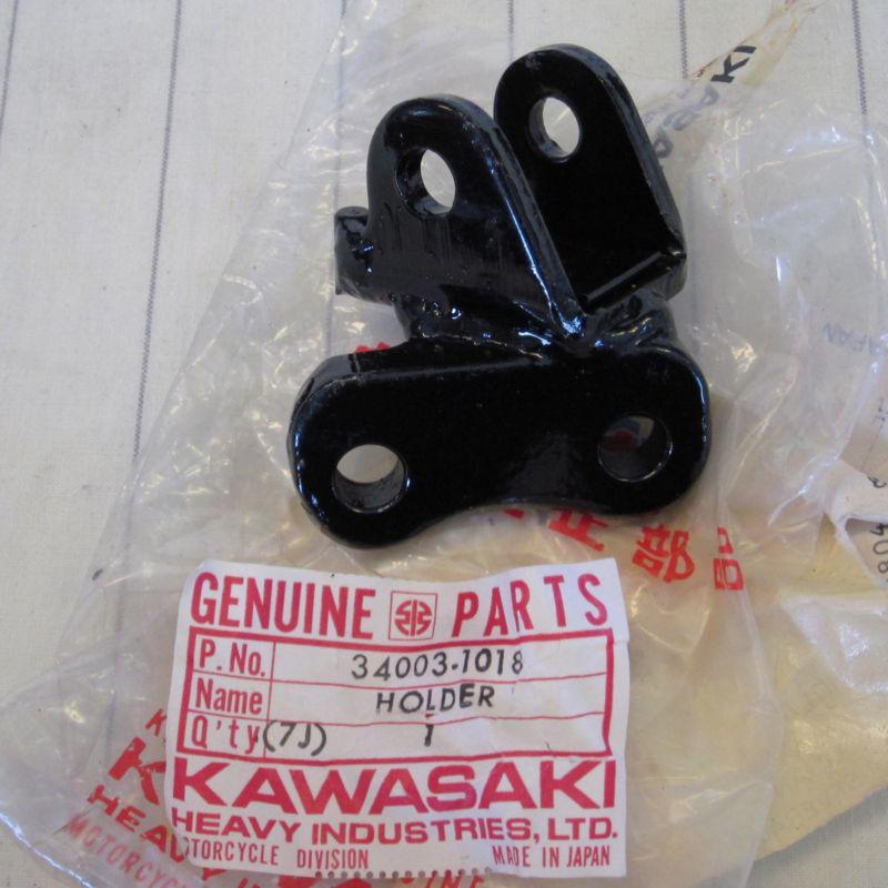 Kawasaki kl footrest bracket holder 34003-1018 nos