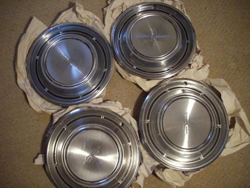 Set of four 1967/68 and others oldsmobile cutlass 14" original hubcaps oem