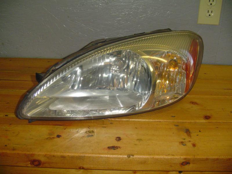 Ford taurus front head lamp assembly