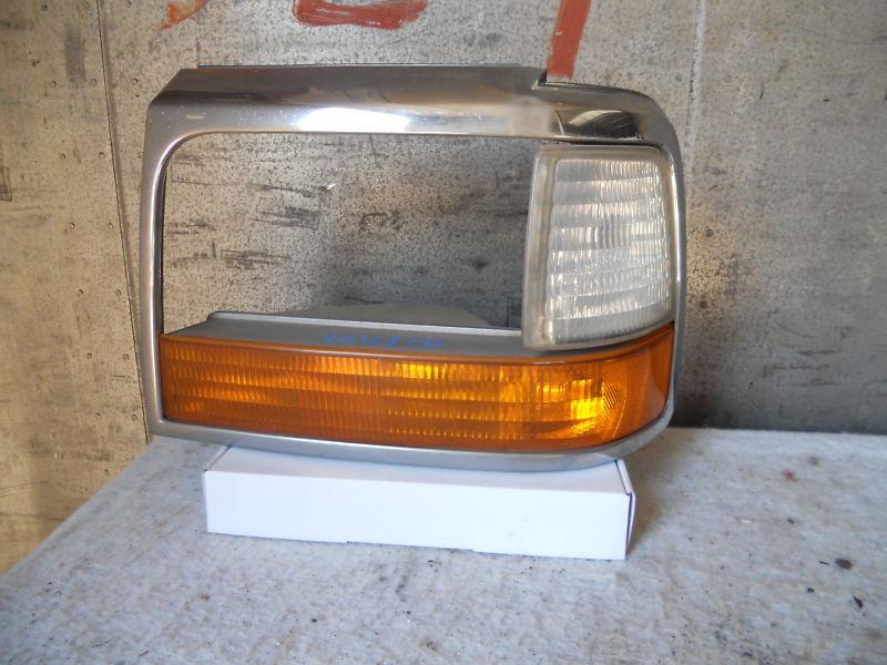 1994 ford f150 left head light bezel oem
