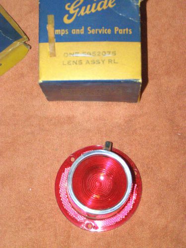 Gm# 5952075 1961 pontiac bonneville left tail lamp lens with trim