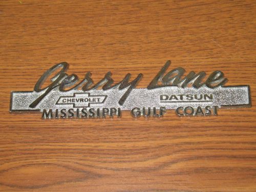 Vintage gerry lane chevrolet datsun  metal auto dealer emblem nameplate