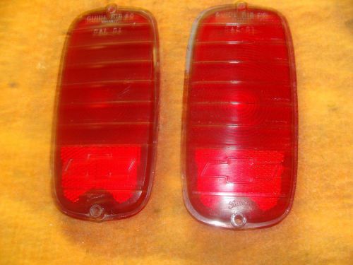 A pair of used 1960-1966 chevy pickup tail light lenses