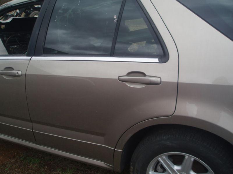2004 cadillac srx door (driver side rear) sk# 7704