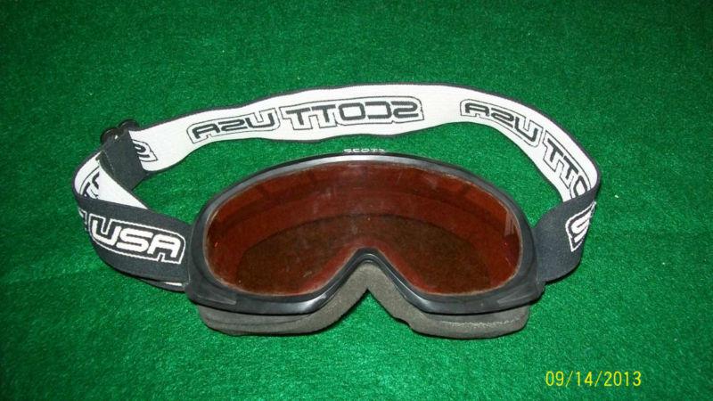 Scott motorcycle/motorcross goggles for a child, tinted lenses