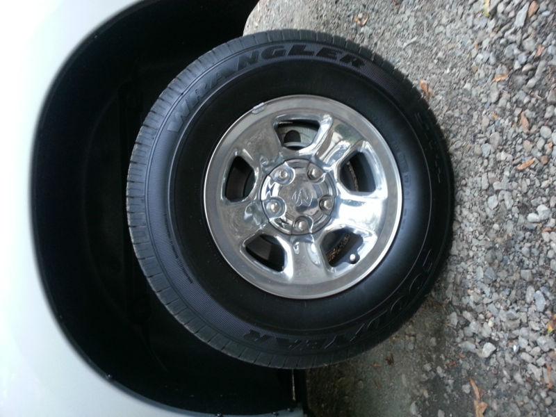 Set of four dodge ram 17" factory steel rims and slightly used goodyear tires 